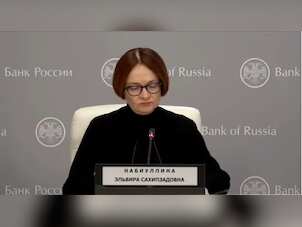 Russian Central Bank chief noted for coded dress wears funeral black to signal death of economy