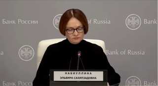 Russian Central Bank chief noted for coded dress wears funeral black to signal death of economy