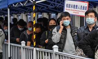 China fires mayors and closes schools as an outbreak spreads