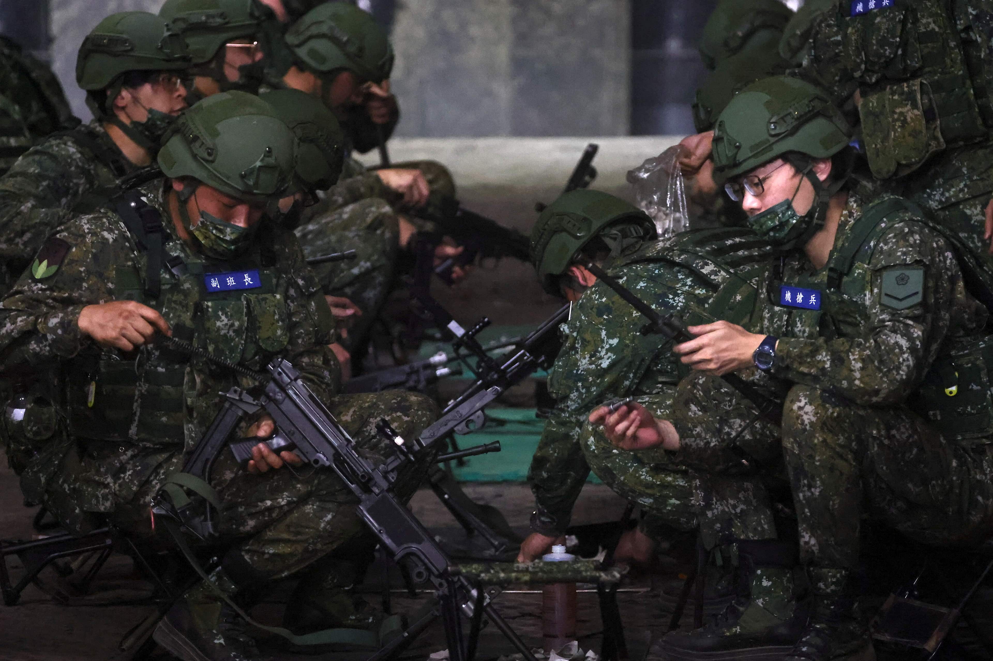 under attack, Taiwan military gears 