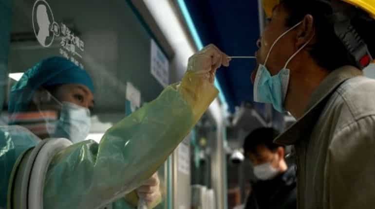 As virus cases surge, can China's zero-Covid strategy hold?
