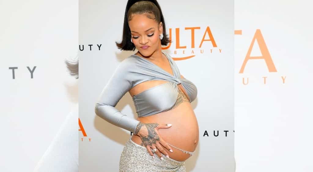 Rihanna sparkles in silver ensemble while flaunting her belly at Fenty Beauty event