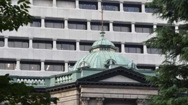 Bank of Japan says no tightening as oil stirs inflation