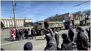 'Go Home': Ukrainian protesters confront Russian military vehicles in Kherson
