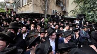 Revered Jewish sage buried in one of the largest gatherings in Israel's history