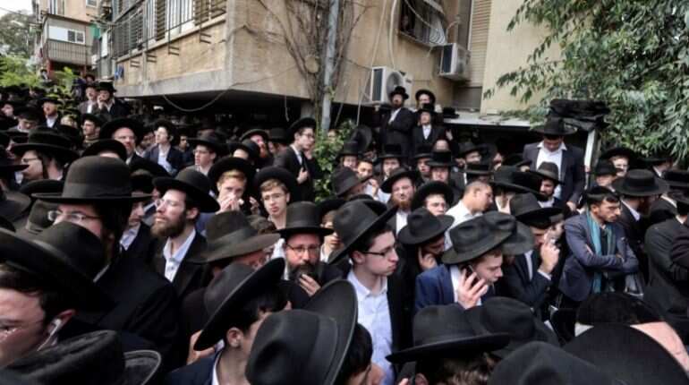 Revered Jewish sage buried in one of the largest gatherings in Israel's history