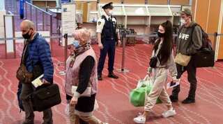 Japan minister brings Ukrainians from Poland on government plane