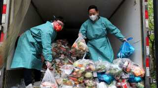 Shanghai vows to improve food deliveries as discontent grows over Covid curbs
