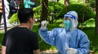 COVID-19: China closes Guangzhou to most arrivals as outbreak spreads