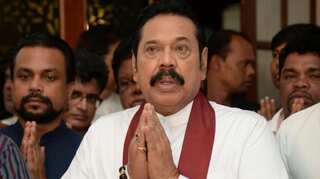 Sri Lankan PM Mahinda Rajapaksa says government is working to overcome economic crisis