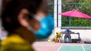Shanghai hits Covid milestone, Beijing still wary