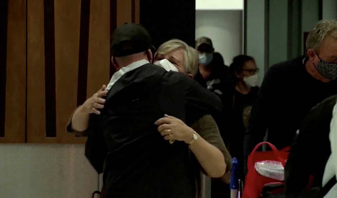 With hugs, tears and Maori performers, New Zealand welcomes Australian visitors as curbs ease
