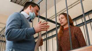 Russian artist accused of spreading 'fake news' after replacing grocery price tags with anti-war slogans