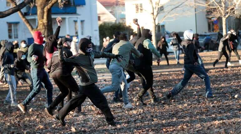 Protesters attack police
