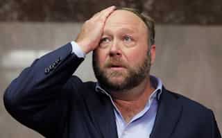 Conspiracy theorist Alex Jones ordered to pay $965 million in damages to Sandy Hook victims' families