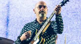 Oasis guitarist Paul Arthurs diagnosed with tonsil cancer; informs fans