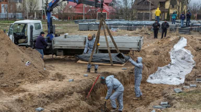 Ukrainian police find three bodies with hands tied near Bucha
