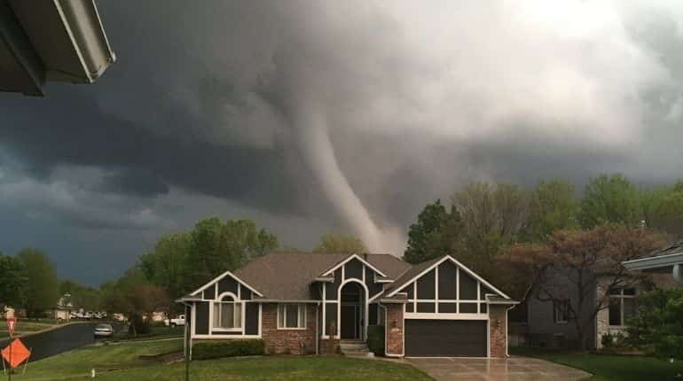 Kansas tornado's trail of devastation: Videos show cars being tossed into walls. Watch it here