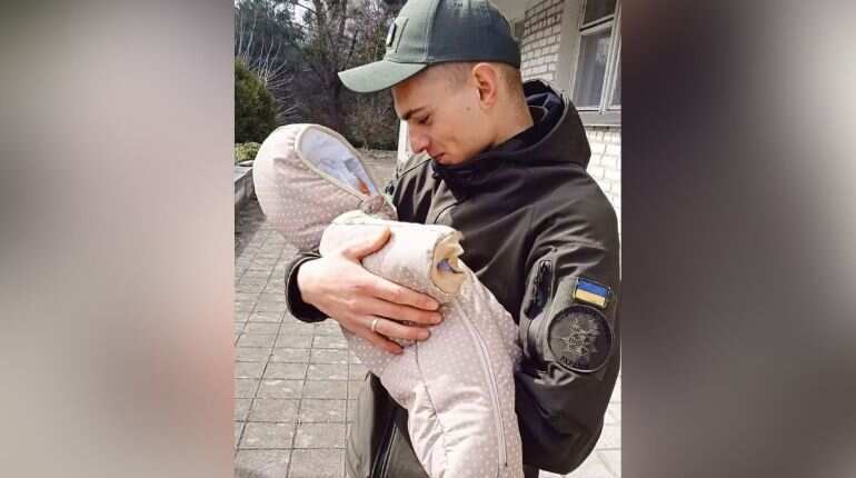 Moment of joy: Ukrainian soldier holds new-born baby in arms for first time Moment of joy: Ukrainian soldier holds new-born baby in arms for first time