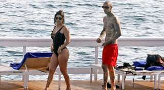 Kourtney Kardashian turns up the heat in swimsuit as she vacations with Travis Barker