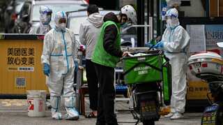 Shanghai reports 20 new COVID-related deaths as residents are being sent out of city during crackdown