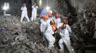 A miracle? After six days, woman found alive in rubble of collapsed building in China