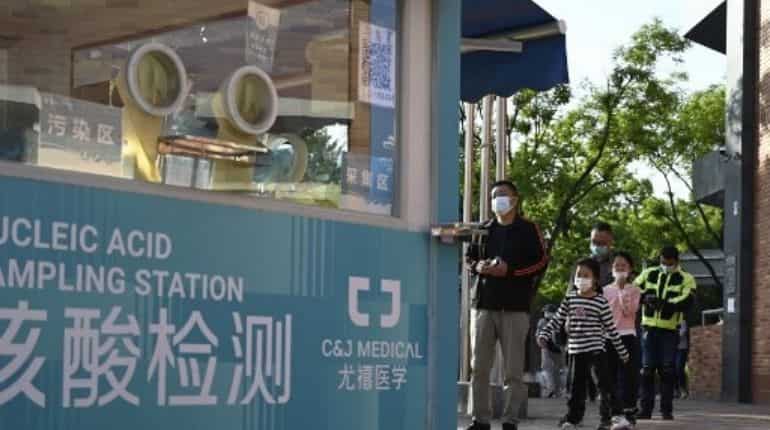 China makes Covid PCR tests a part of everyday life, opens permanent ...