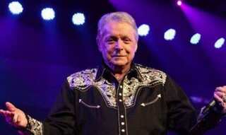Country singer Mickey Gilley, whose bar launched 'Urban Cowboy,' dies