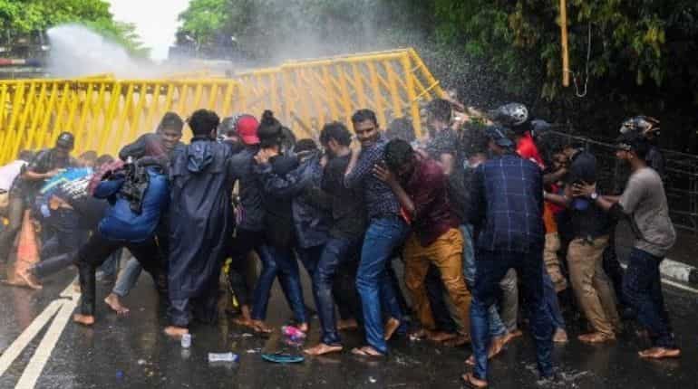Police fires water canons to disperse the protesters