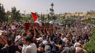 Outcry after Israel police beat mourners at journalist funeral
