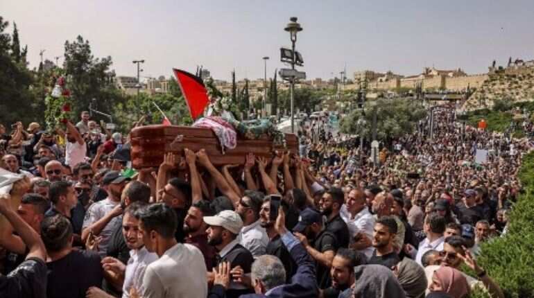 Outcry after Israel police beat mourners at journalist funeral