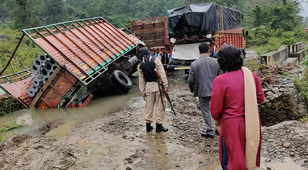 Flash floods in India state of Assam, rain triggers landslides