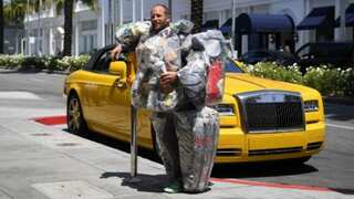 'Put trash in its place': This is why an environmental activist is wearing trash in posh LA
