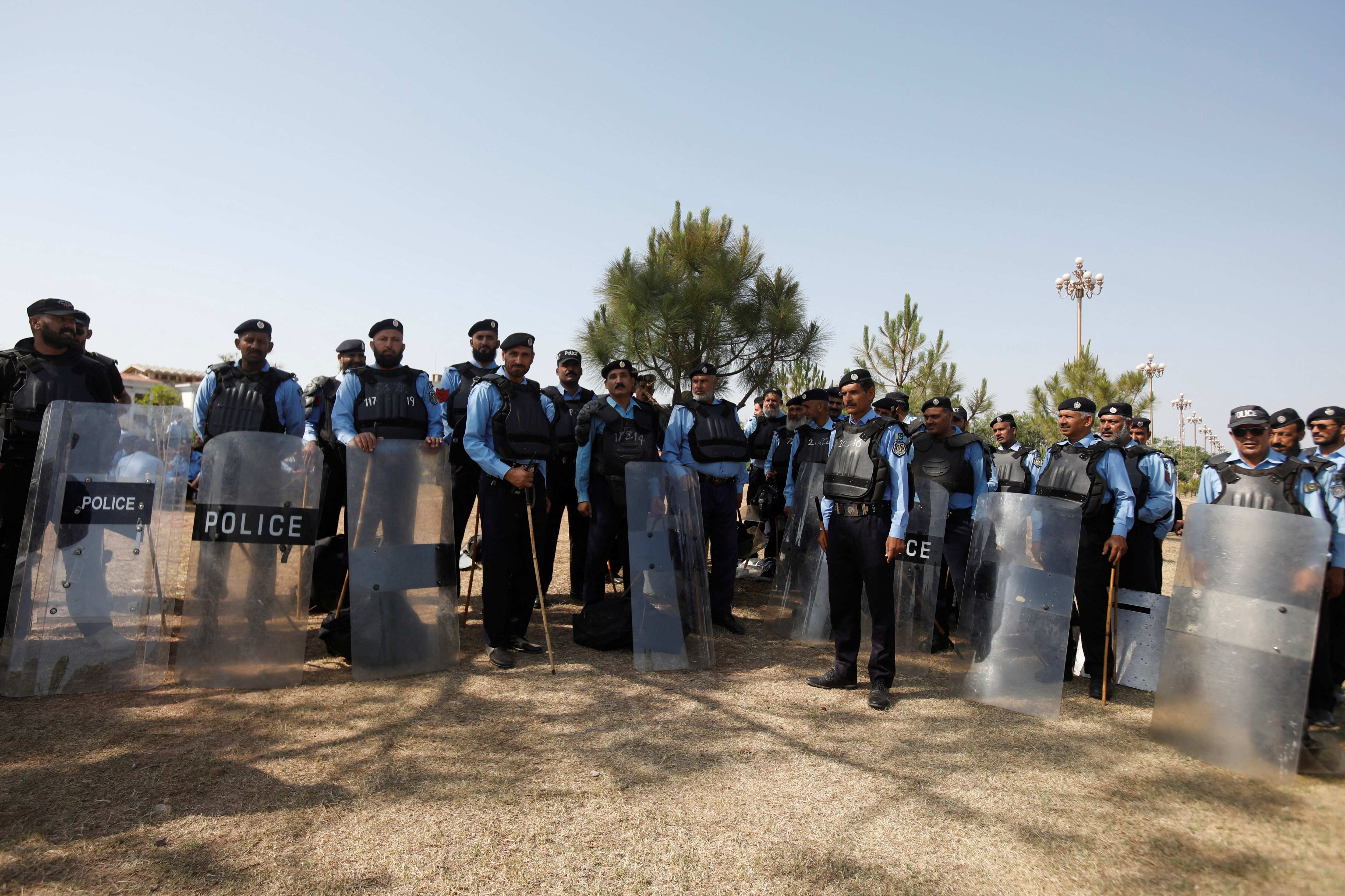 Police officers deployed to prevent protestors from entering Islamabad.