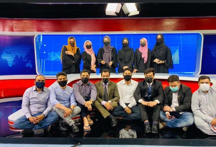 Male presenters wear medical masks to protest against Taliban in Afghanistan