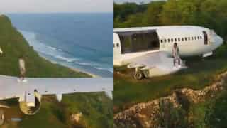 In breathtaking video, man walks on aircraft’s wing on top of hill in Bali, sparks reactions on social media