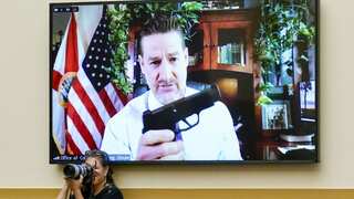 US lawmaker shows off guns at House hearing for new gun violence prevention legislation to make a point