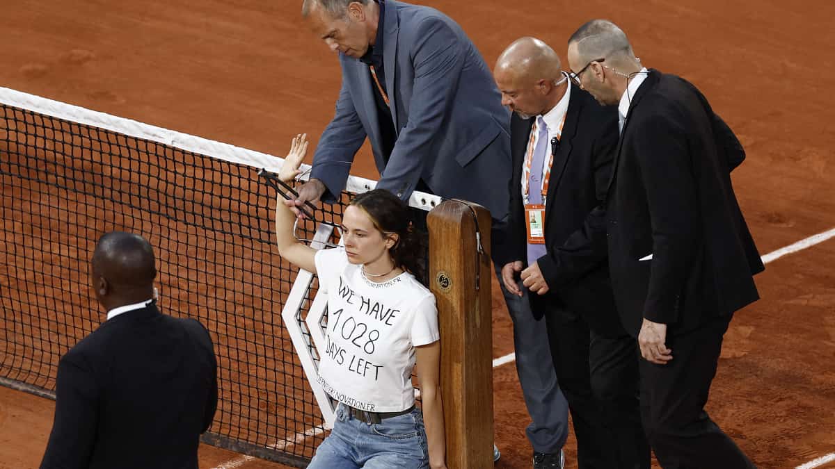 Woman protestor disrupts French Open semi-final, ties herself to the net