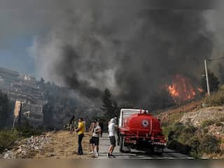 In pics - Greece evacuates outskirts of Athens after wildfire threat