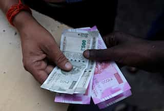 Indian rupee slides to record low of 77.82 against US dollar
