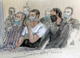 Prosecutors ask for life sentences for 12 men at trial for Paris terror attack
