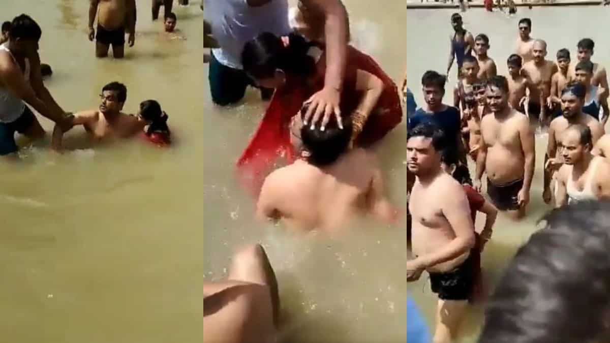 Watch: Mob abuses, thrashes man for kissing wife while taking a dip in Indian river Watch: Mob abuses, thrashes man for kissing wife while taking a dip in Indian river