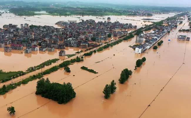 Record floods threaten Southern China