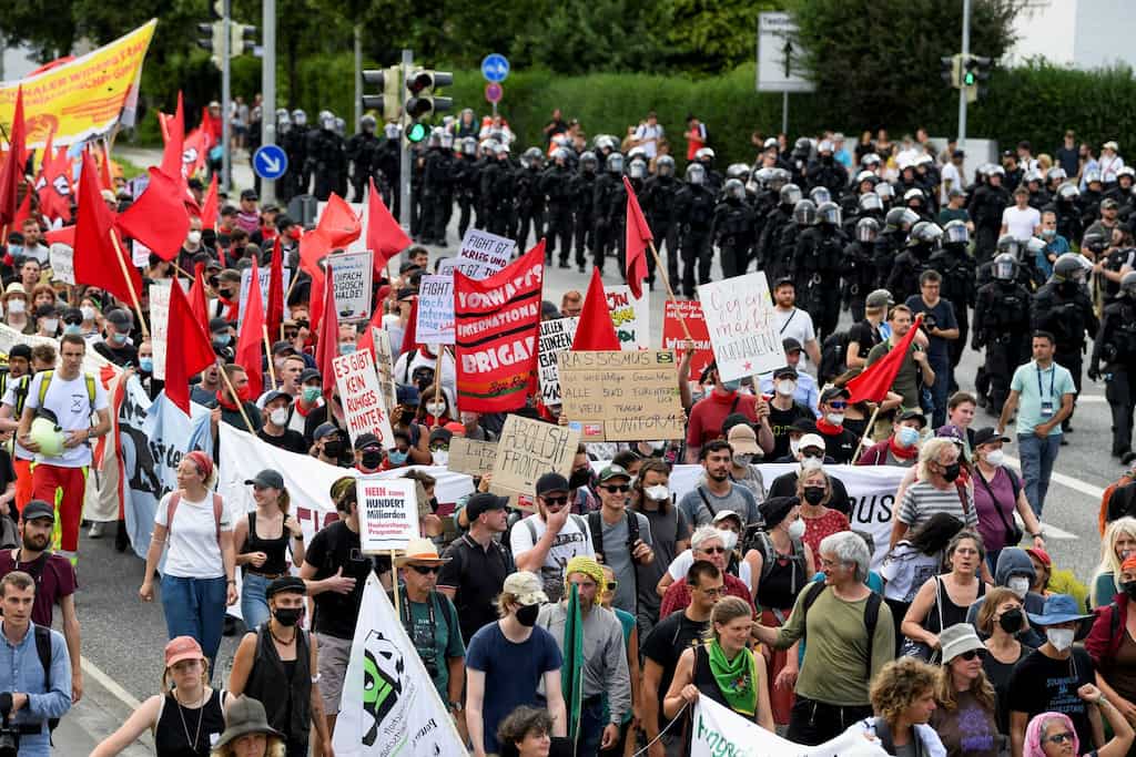 Hundreds of protesters gather outside G7 venue to demand climate protection