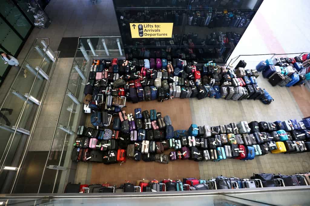 Fresh woes for summer travel: Luggage piles join long airport lines