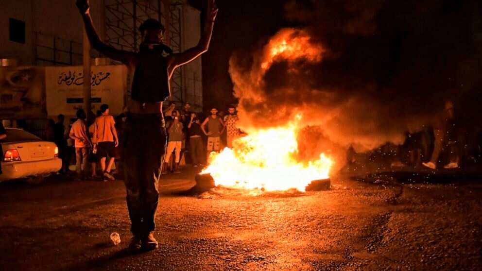 Protesters set fire to parts of Libya's parliament while staging demonstrations