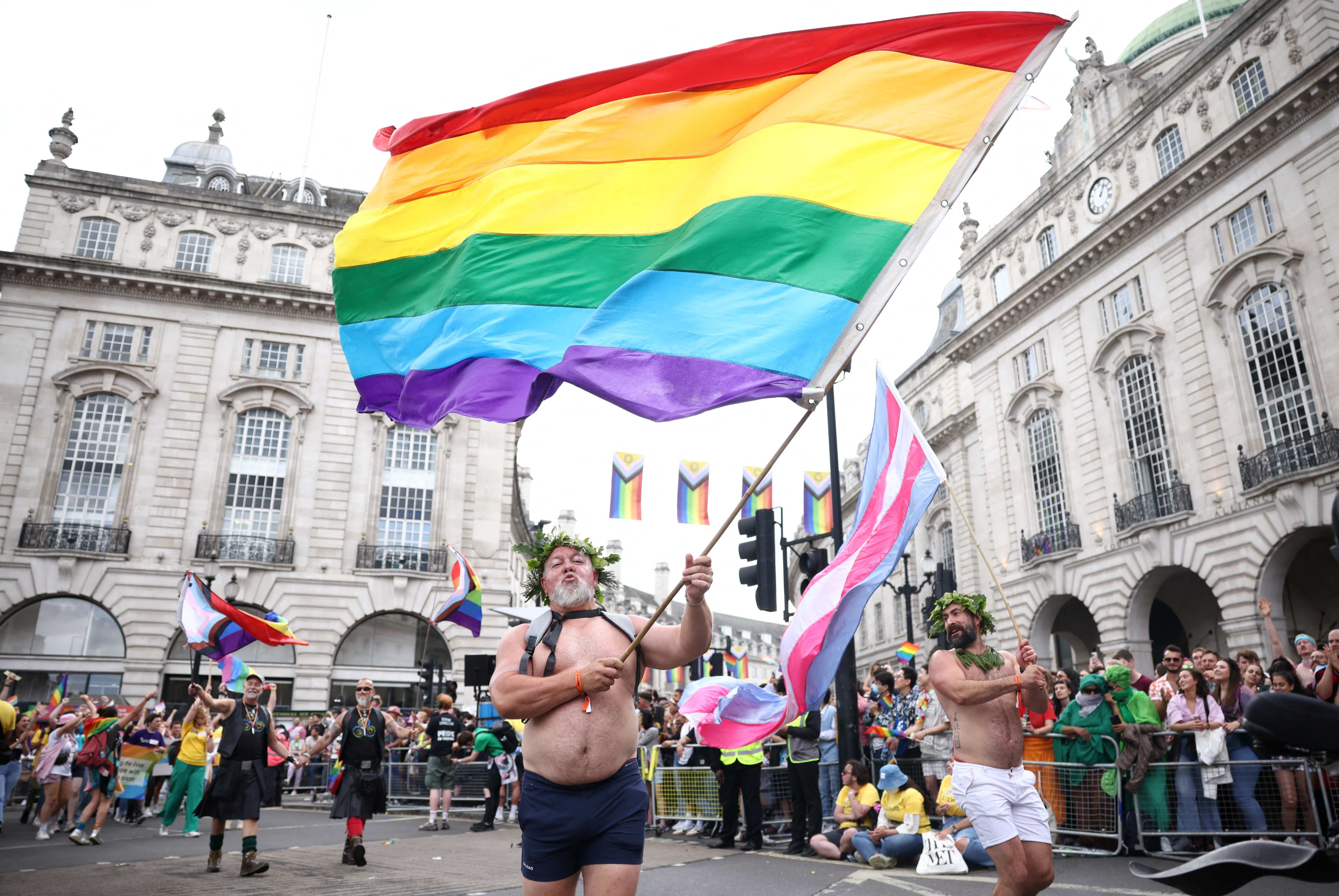 Spectacle of rainbow flags, glitter and sequins