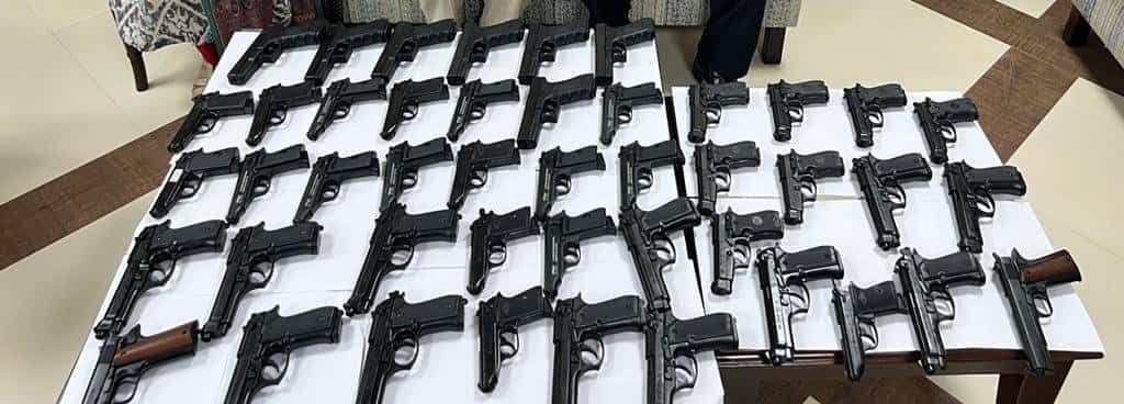 Indian couple detained at Delhi's international airport with 45 pistols Indian couple detained at Delhi's international airport with 45 pistols