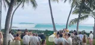 Watch: Towering waves crash a tropical Hawaii wedding
