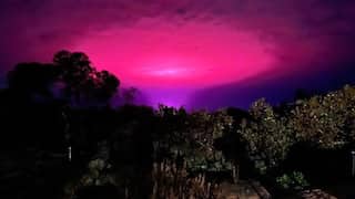Aliens? Celestial phenomenon? Weed facility? Bizarre pink glow over an Australian town